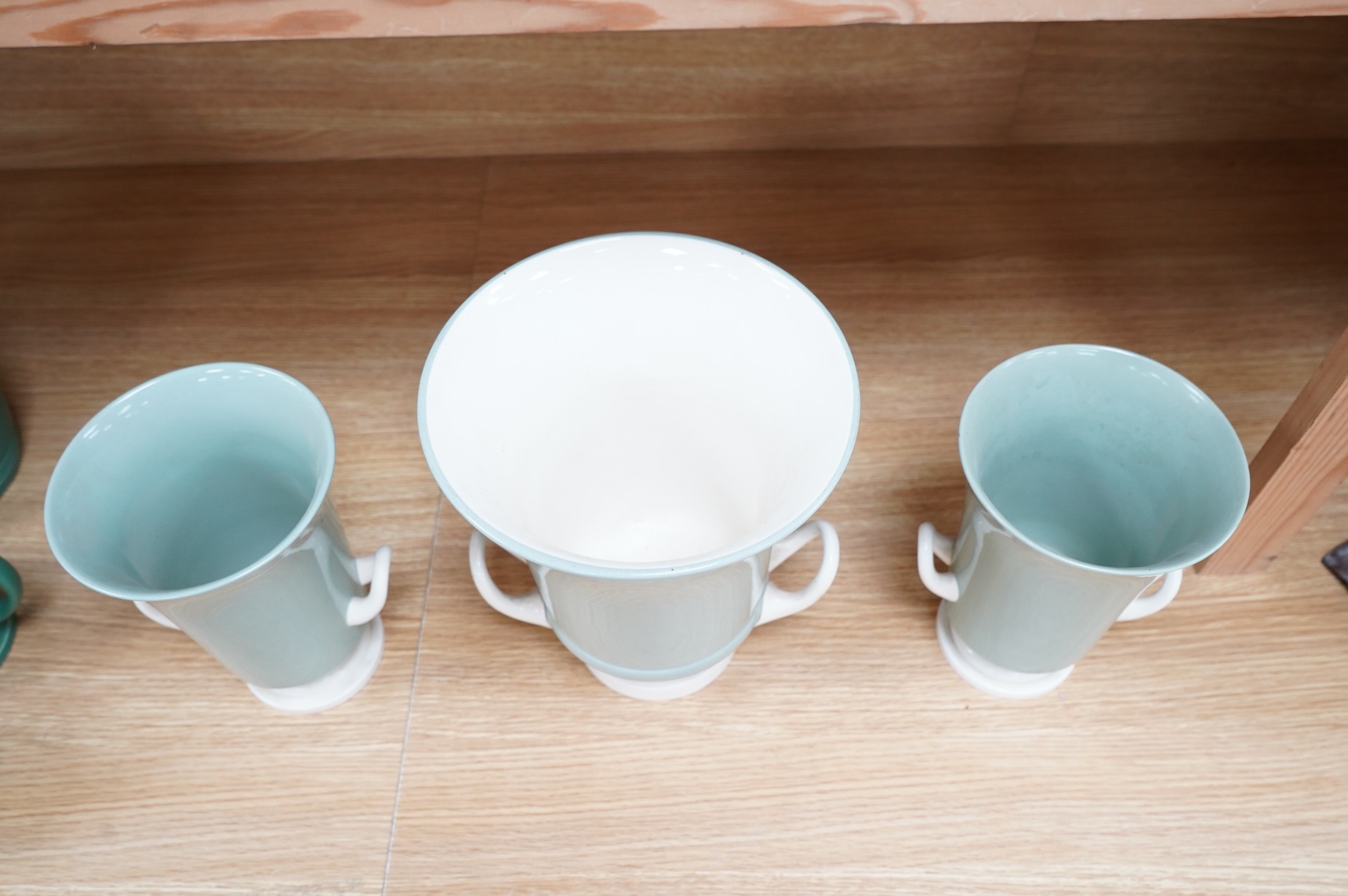 Keith Murray for Wedgwood, a garniture of three graduated twin handled slipware vases, stamped to the bases, largest 25cm high
